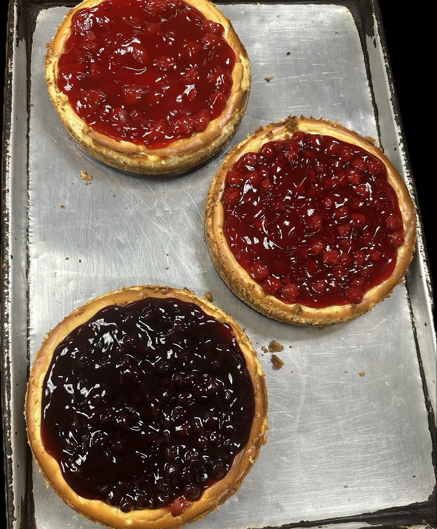 Homemade cheesecakes with fruit topping at Carlo's
